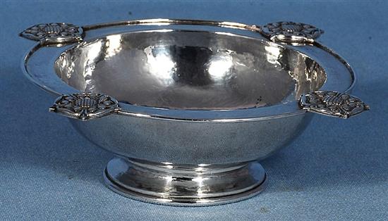 A George V Arts & Crafts silver raised circular dish, by Omar Ramsden, Dia (to Rose motifs) 165mm, weight 7.2ozs/226grms